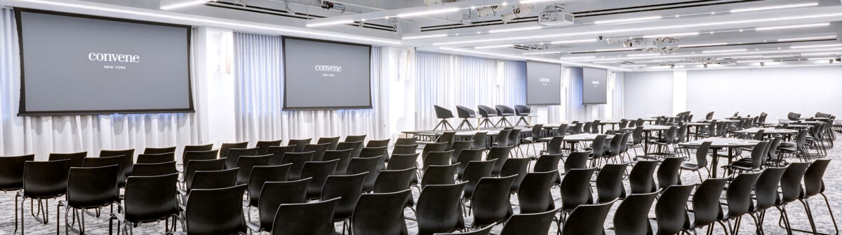 The Forum at Convene 117 West 46th Street is set up in a theater style with lots of black chairs