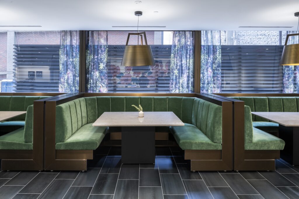 Green banquette seating in Convene Gallery