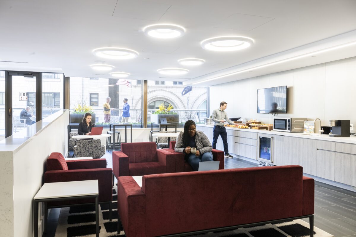 People in dining lounge Convene One Boston Place