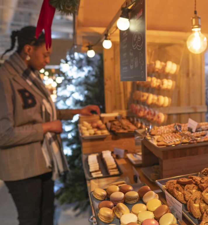 Person selecting cookies in market