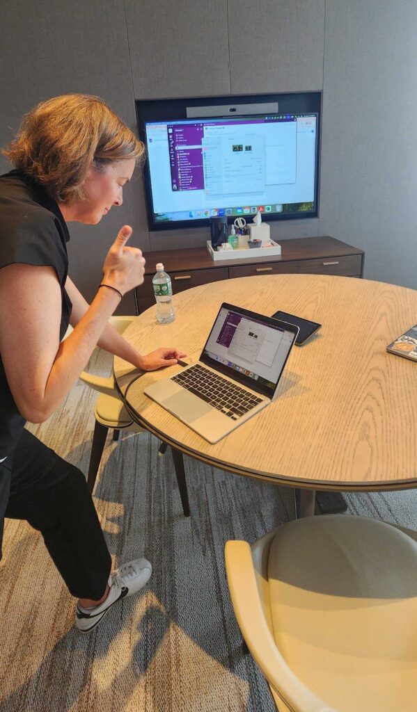 Convene CPO gives thumbs up while working on a computer.